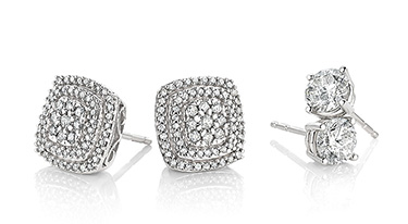 Two pairs of diamond earrings.