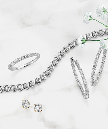 Diamond ring, bracelet and earrings.