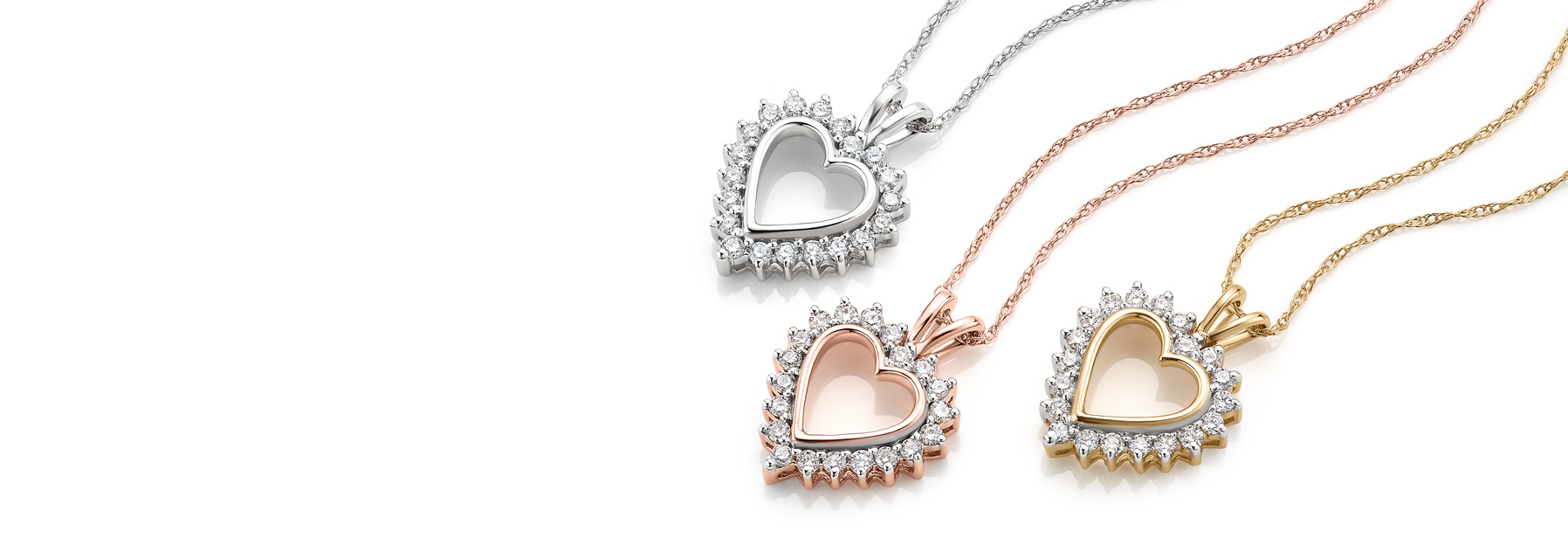 Assortment of diamond heart pendants.