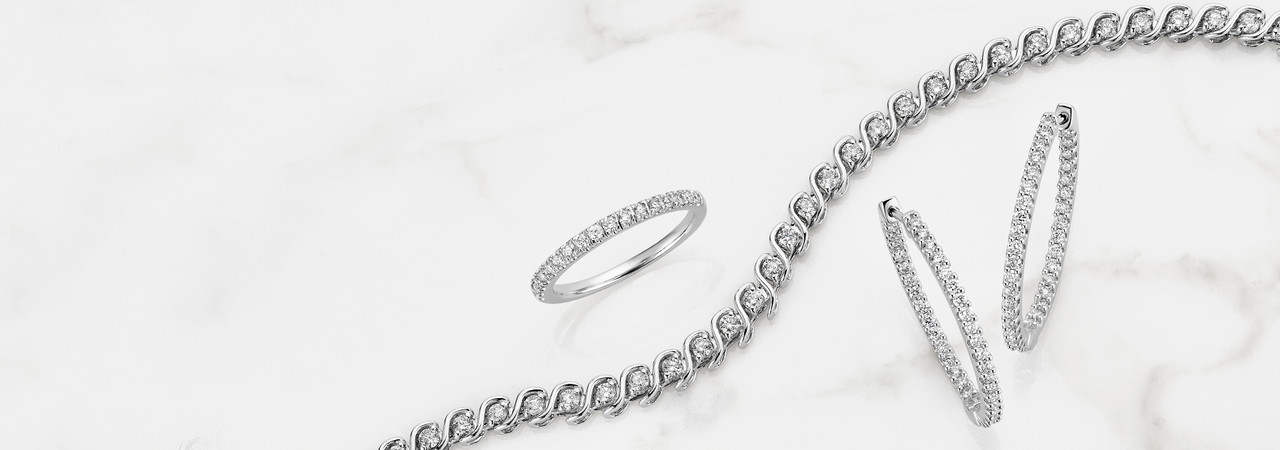 Diamond hoops, ring and bracelet.