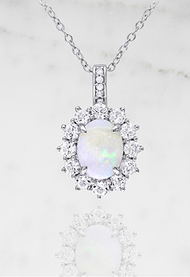 Opal, white topaz and diamond pendant.